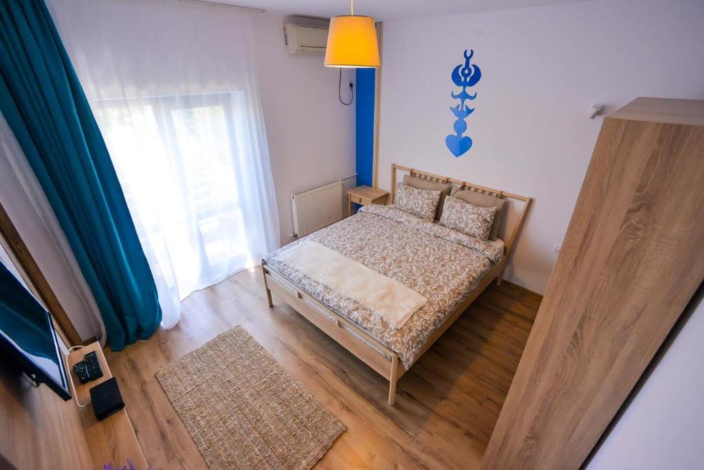 Postel nebo postele na pokoji v ubytování Pensiunea Complex Castalia
