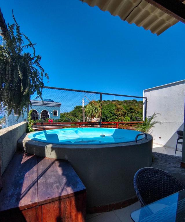 a bath tub sitting on top of a patio at Casa com vista mar in Pipa