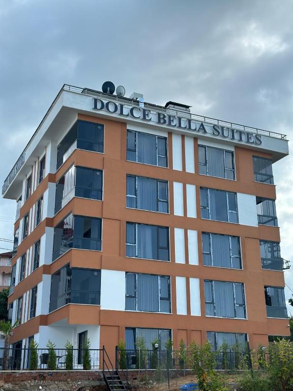 a building with a sign on top of it at Dolce Bella Suites in Trabzon