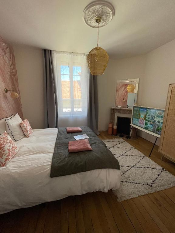 Postel nebo postele na pokoji v ubytování MAISON LE BEAULIEU