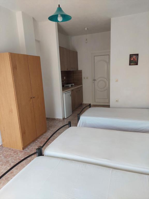 Postel nebo postele na pokoji v ubytování Lelegianni Studios and Apartments