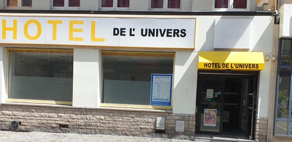 a hotel de bele ut cylinders sign on a building at Hôtel de L'UNIVERS LILLE in Lille