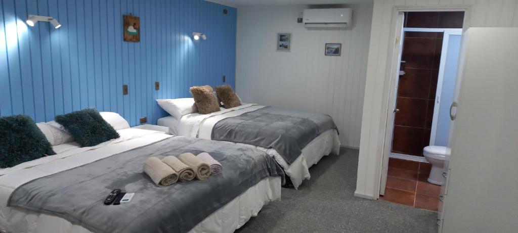 Postel nebo postele na pokoji v ubytování Hostal 1009 Valdivia