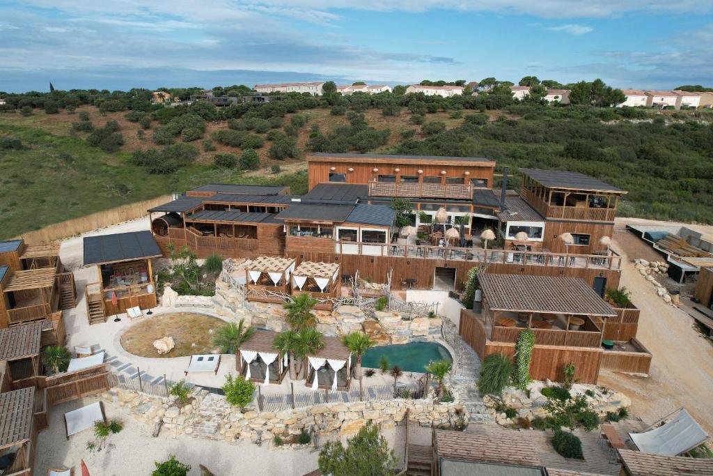 an aerial view of a building with a resort at Villa Occitana in Calvisson