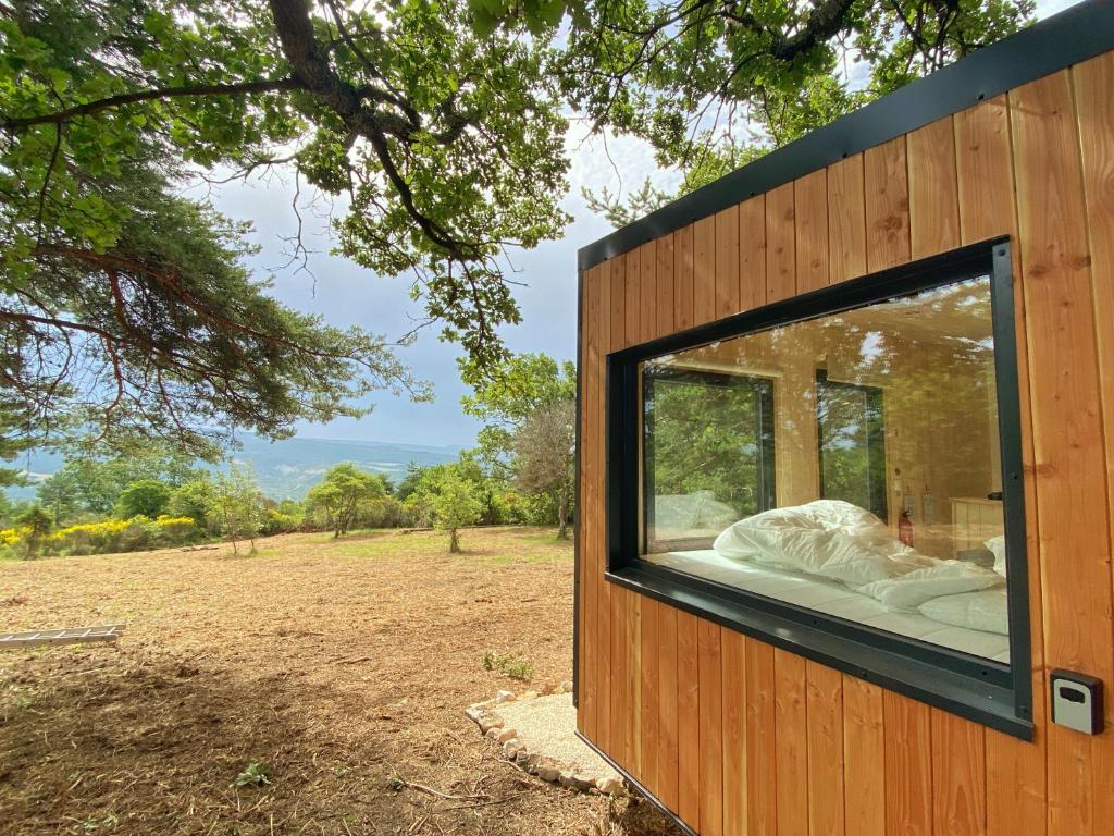 a large window on the side of a house at La Bastide Provençale - Terre d'Ocre & de Lavande in Viens