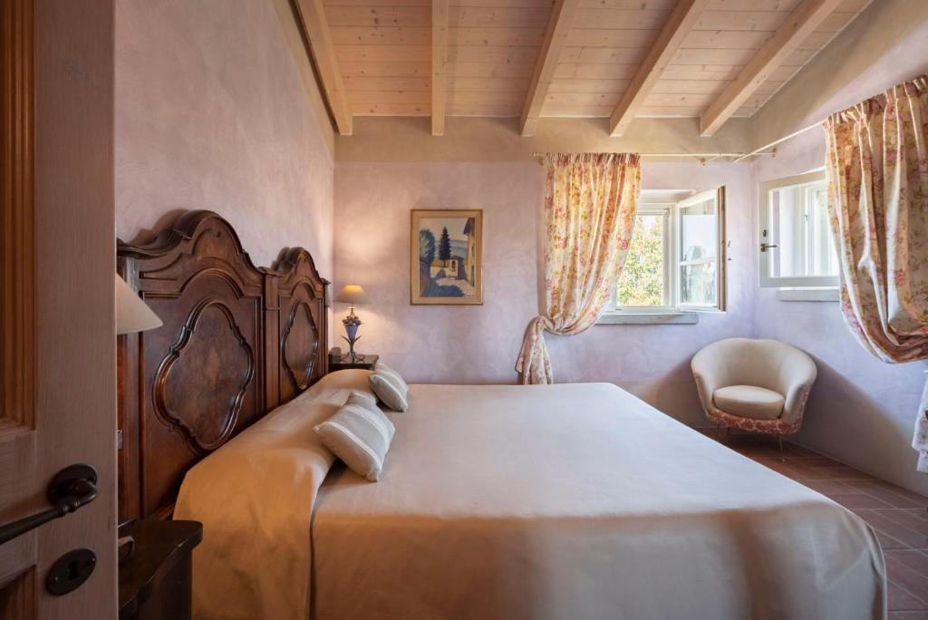 Postel nebo postele na pokoji v ubytování Guadalupe Tuscany Resort