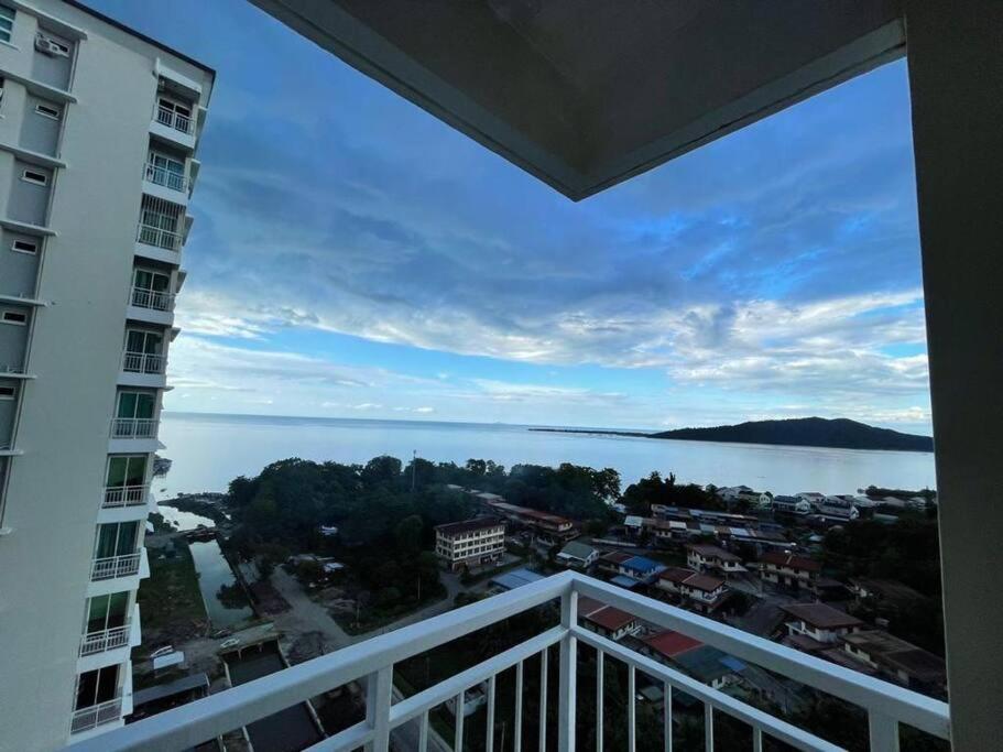 a view of the water from the balcony of a building at Borneo Cove Seaview Sandakan in Sandakan