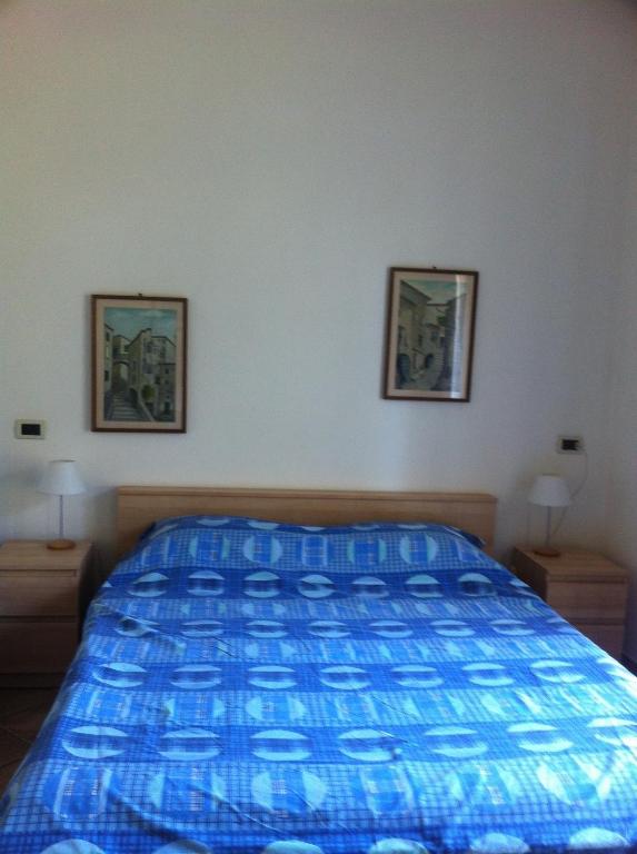 Łóżko lub łóżka w pokoju w obiekcie La casa di Fedra