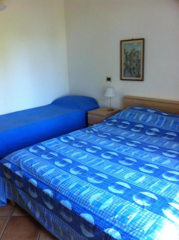 Łóżko lub łóżka w pokoju w obiekcie La casa di Fedra