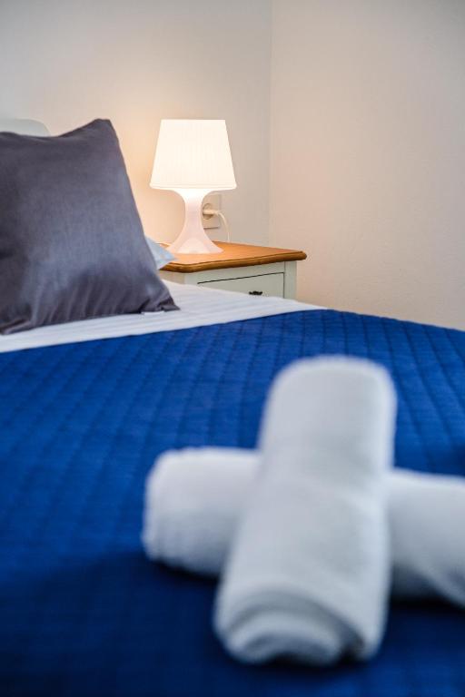 Postel nebo postele na pokoji v ubytování Rooms Anna