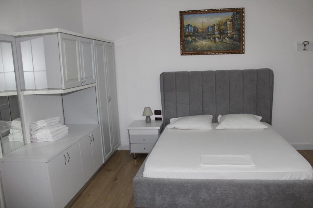 Postel nebo postele na pokoji v ubytování HC Hotel & Suites