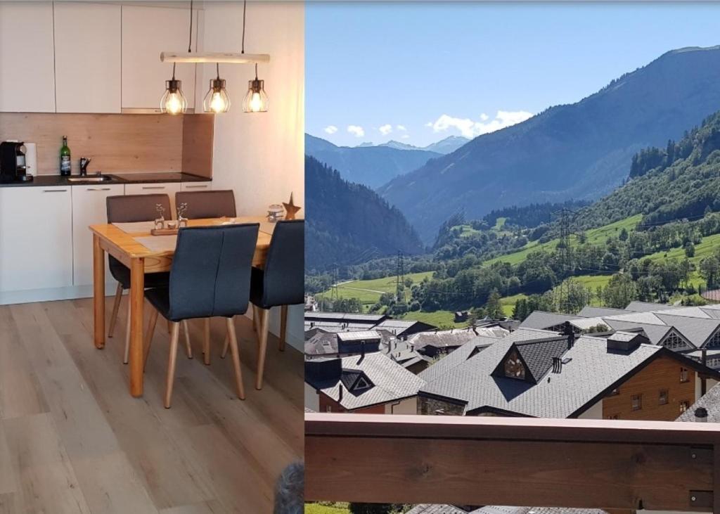 een keuken en een eetkamer met uitzicht op de bergen bij Modernes Wohlfühlstudio im Haus Eldorado mit Traumaussicht in Leukerbad