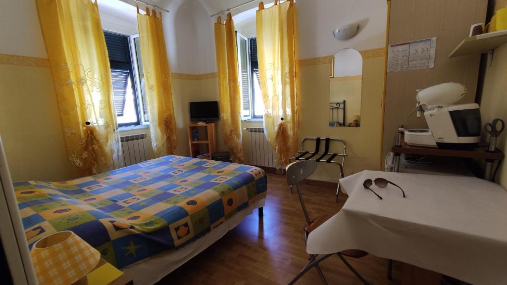 Posteľ alebo postele v izbe v ubytovaní Affittacamere "In Piazzetta da Vasco"