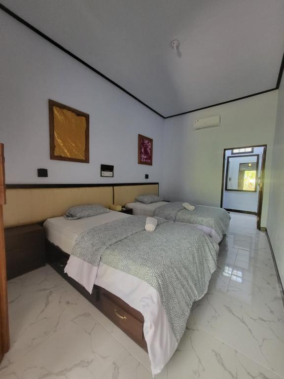 Postel nebo postele na pokoji v ubytování Exotic Backpackers