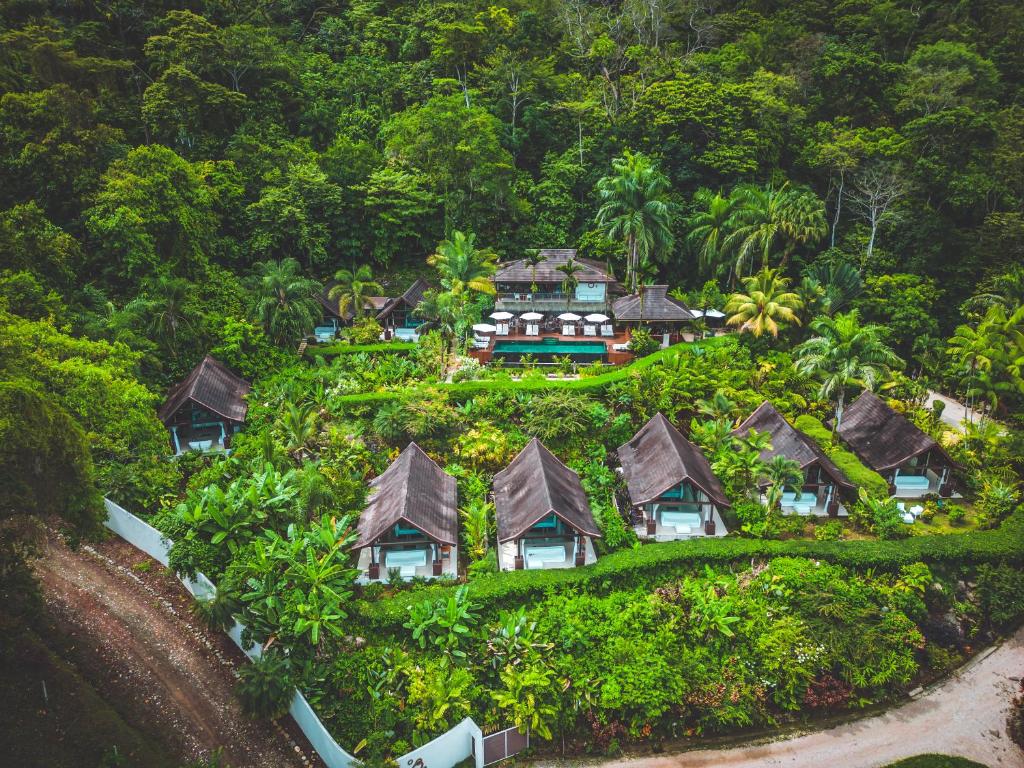 an island with houses on top of a hill at Oxygen Jungle Villas & Spa in Uvita