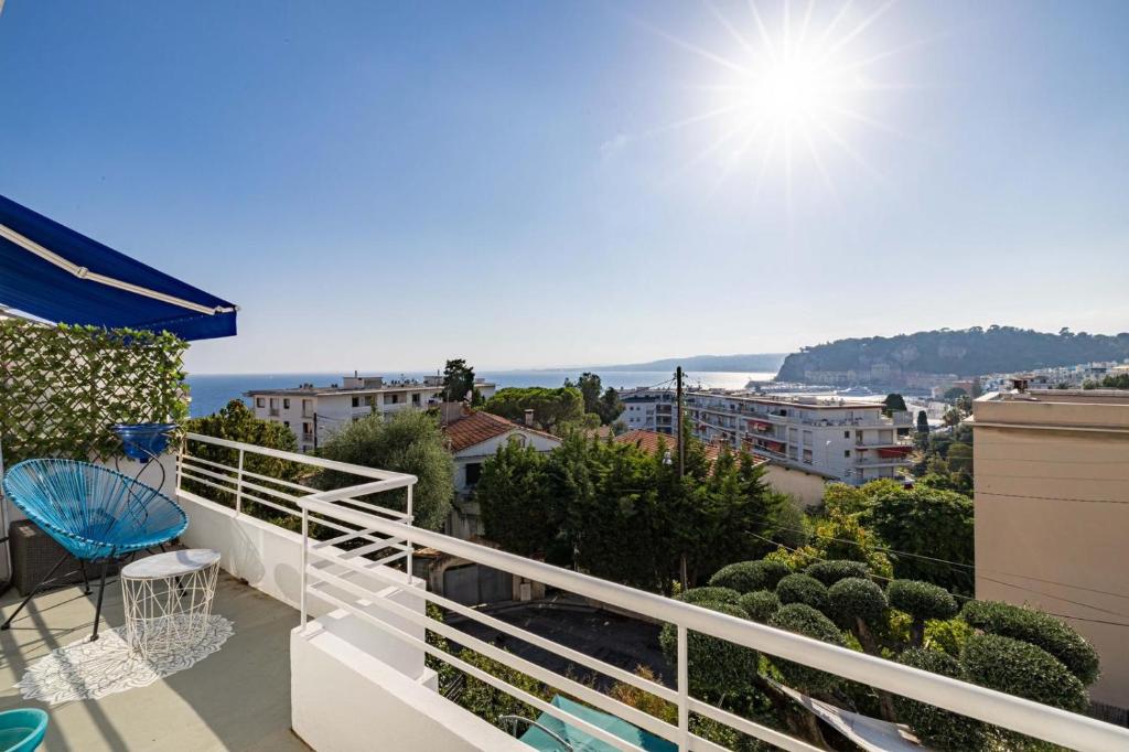 a balcony with a view of the ocean at Villa Iris in Nice
