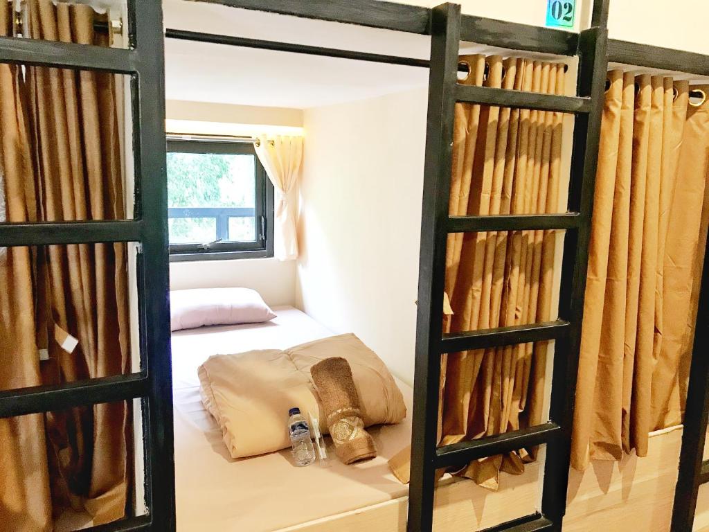 Postel nebo postele na pokoji v ubytování Bromo Dormitory