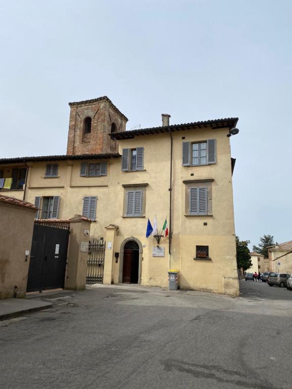 a large building with a tower on top of it at Residence San Bartolomeo in Città di Castello