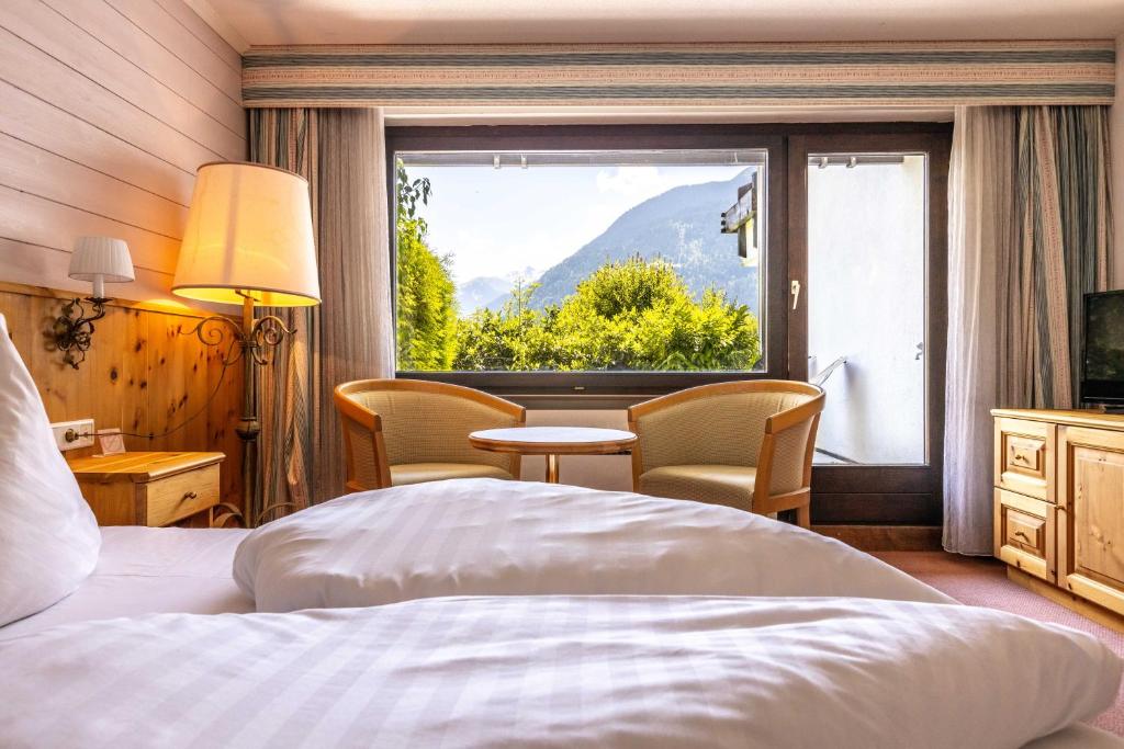 Postel nebo postele na pokoji v ubytování keyone rooms Montafon