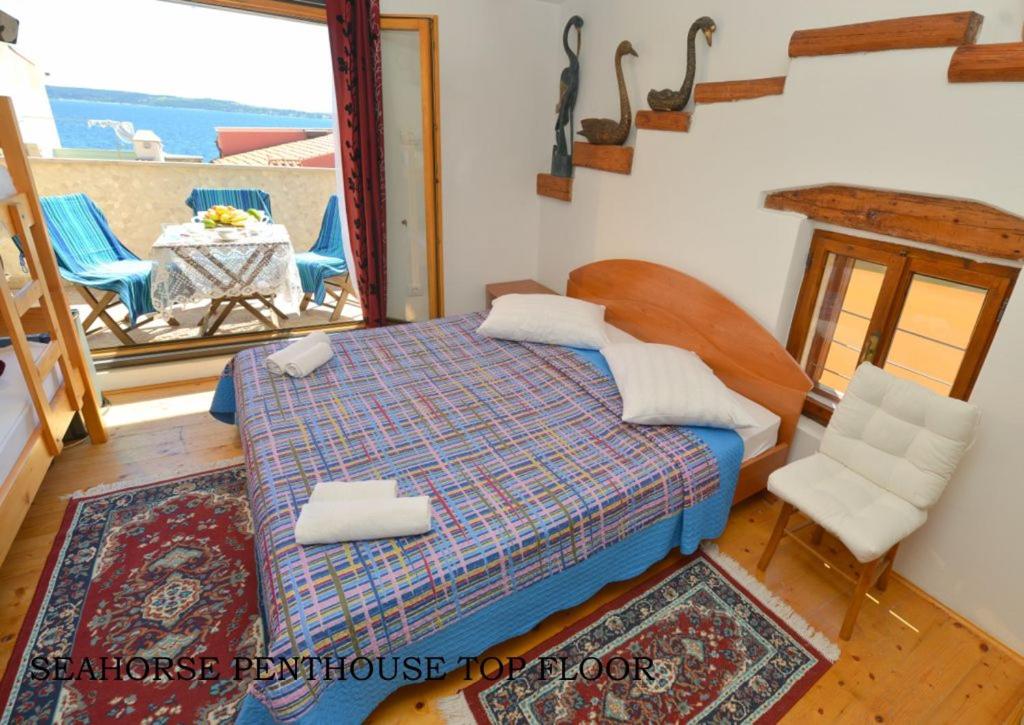 a bedroom with a bed and a view of the ocean at Vila Nada Piran in Piran