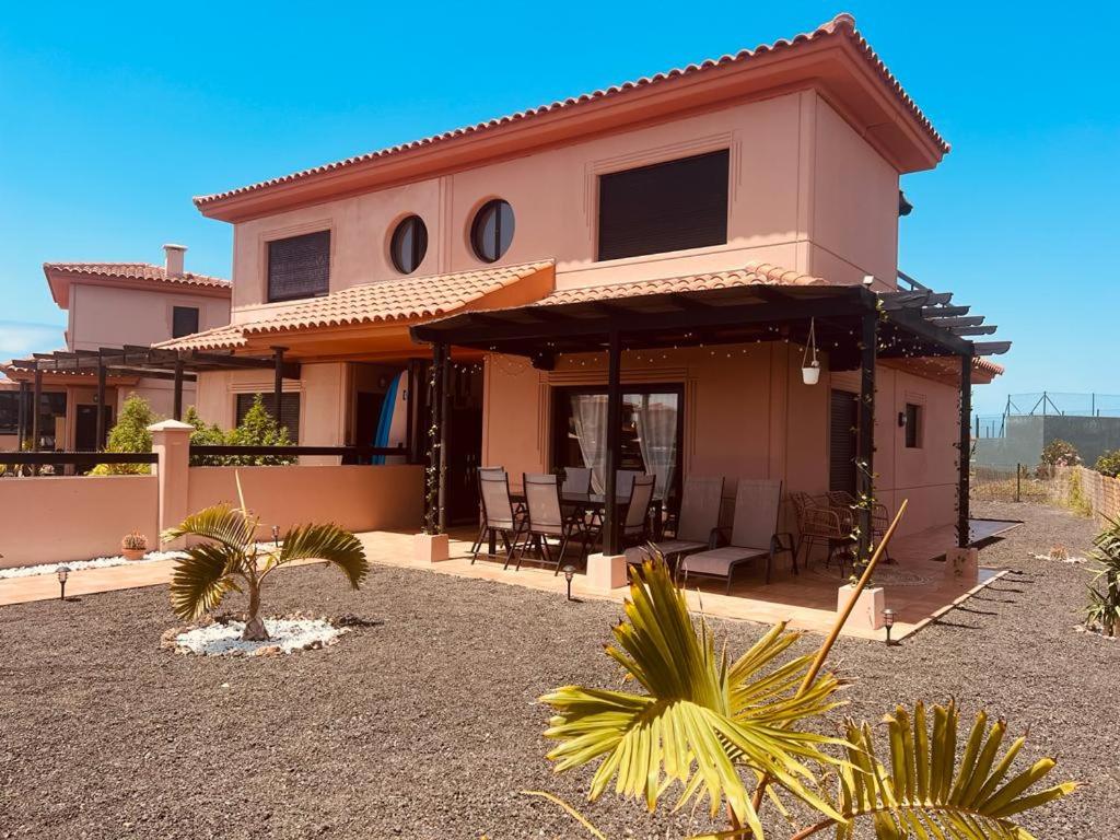 a house with a patio in front of it at Casa Alaia in Lajares