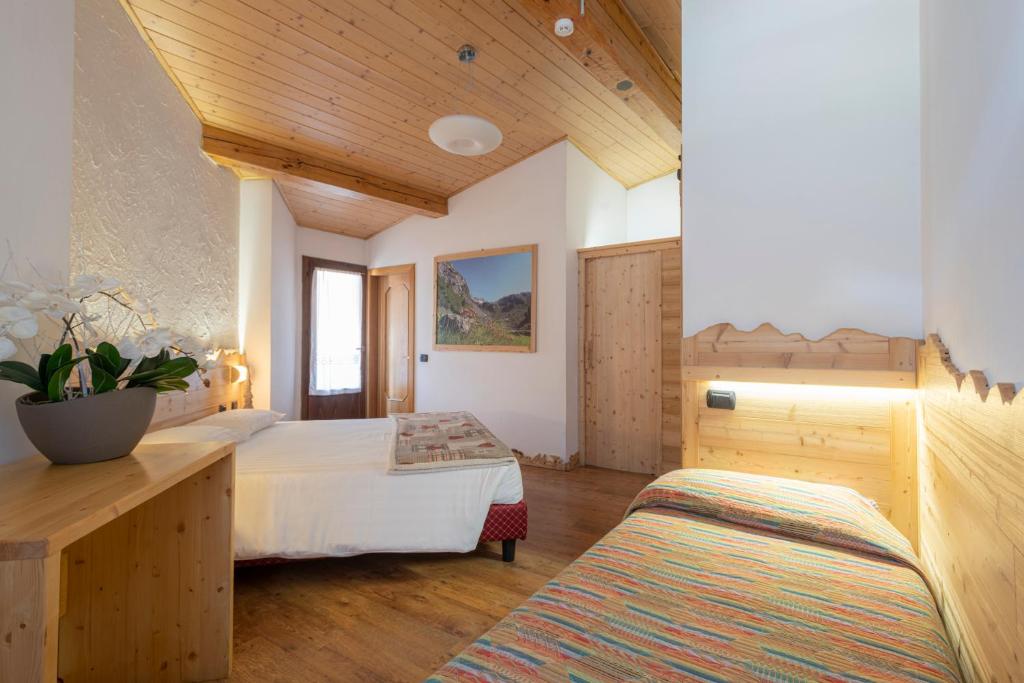 Postel nebo postele na pokoji v ubytování Hotel Cova