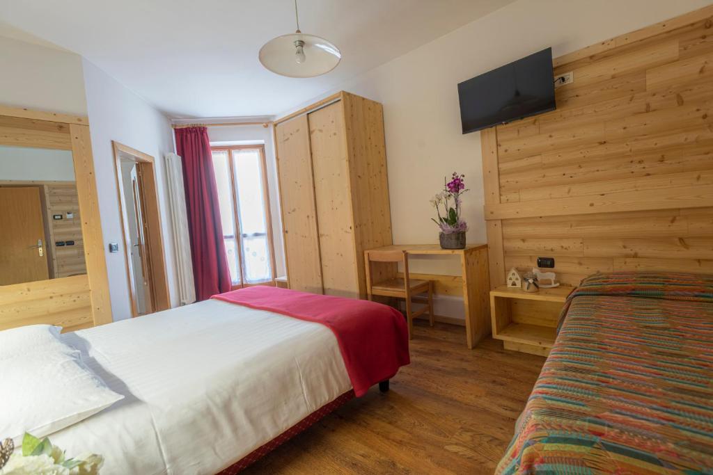 Postel nebo postele na pokoji v ubytování Hotel Cova