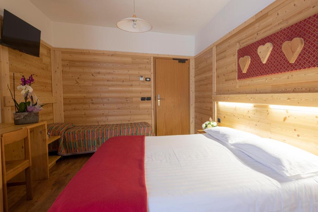 Postel nebo postele na pokoji v ubytování Hotel Cova