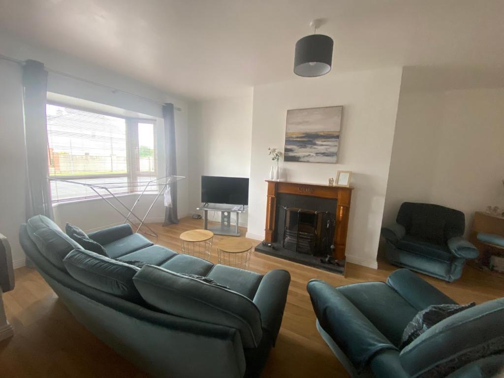 a living room with a couch and a fireplace at Two bedroom apartment in Ennis v95D854 in Ennis