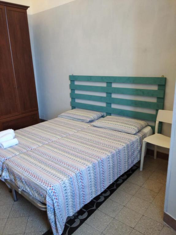 Postel nebo postele na pokoji v ubytování Domus Narnia