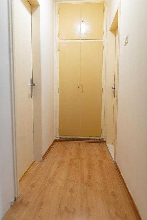 an empty room with a closet and a wooden floor at Apartment Duje in Split