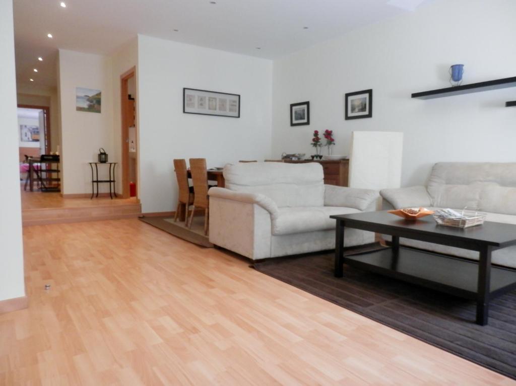 a living room with a couch and a table at Downtown, Cozy Apartment In Lisbon in Lisbon