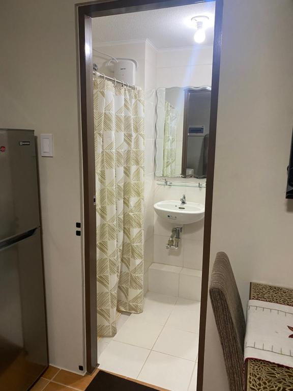 a bathroom with a sink and a toilet and a shower at Affordable 2 bedroom condo unit in Cagayan de Oro