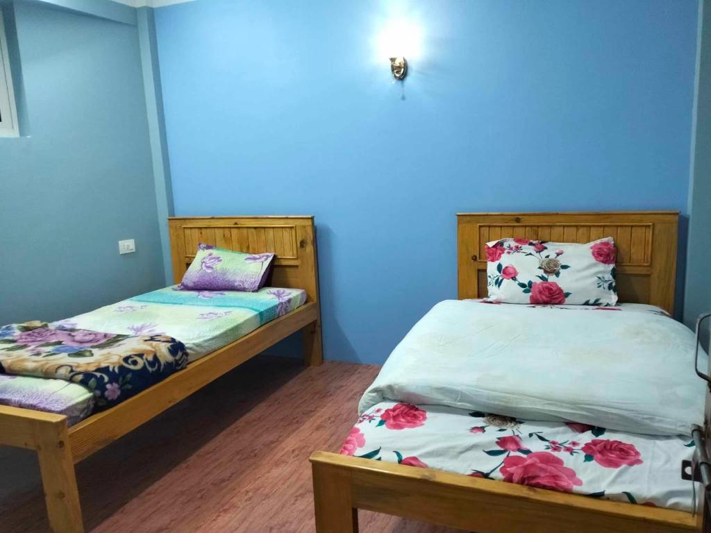 Postel nebo postele na pokoji v ubytování Peace Homestay