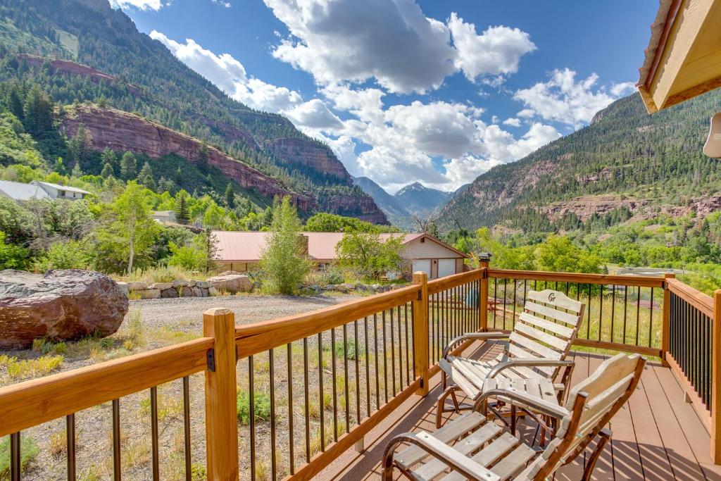 a deck with chairs and a view of the mountains at Stunning Ouray Escape with Panoramic Mountain Views! in Ouray