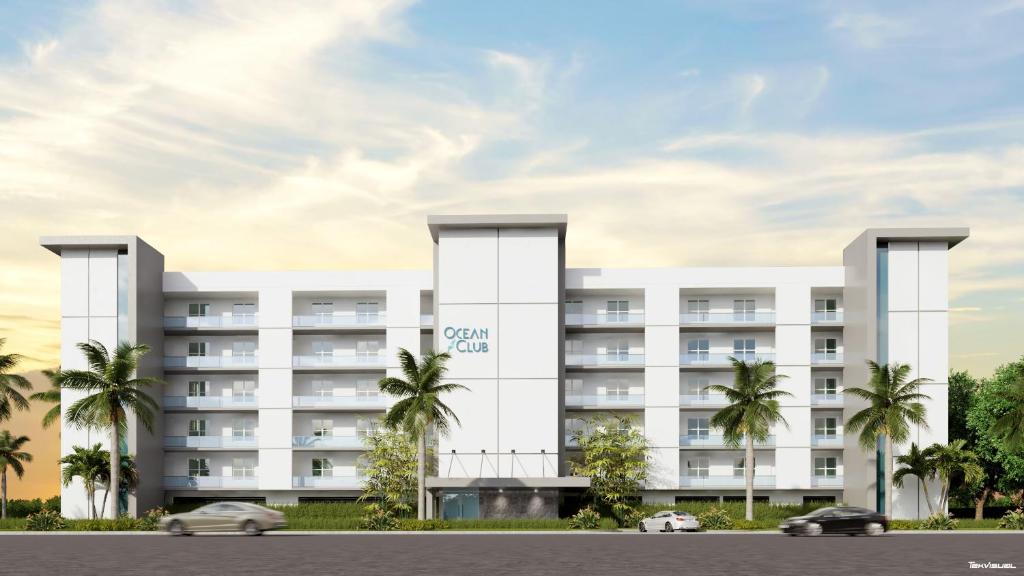 a rendering of a hotel with palm trees at Ocean Club Treasure Island Hotel in St. Pete Beach