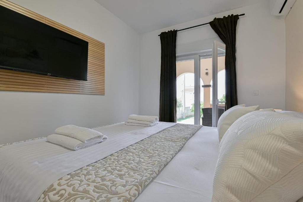 Postel nebo postele na pokoji v ubytování Bralic Residence
