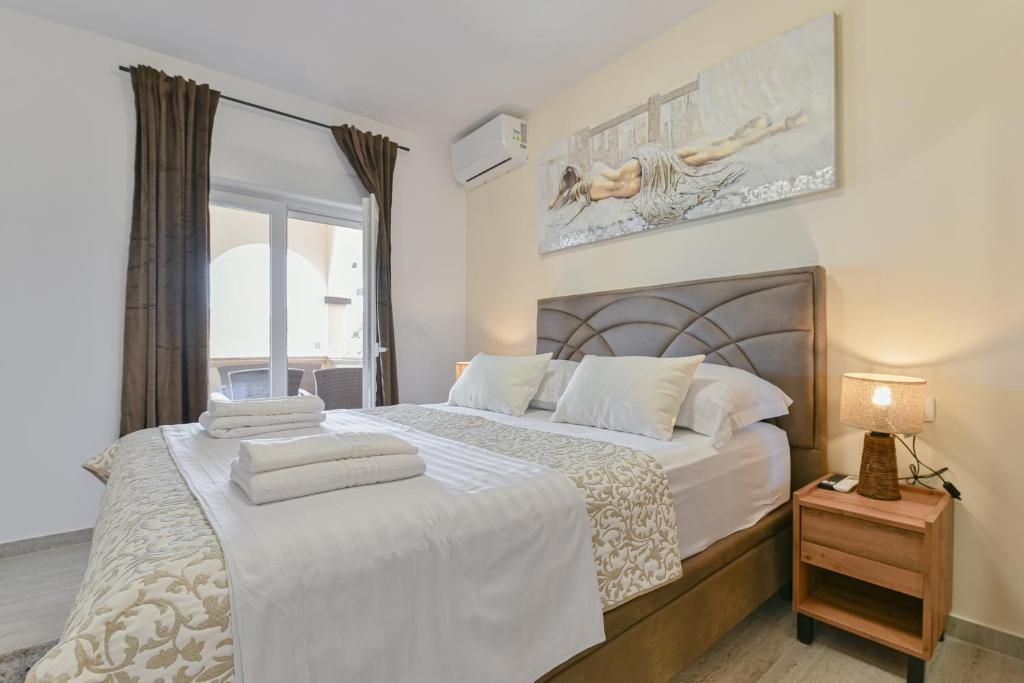Postel nebo postele na pokoji v ubytování Bralic Residence