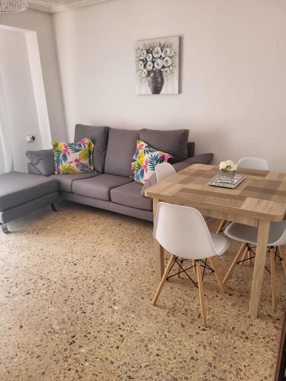 a living room with a couch and a table at Virgen de los desamparados in Puerto de Sagunto