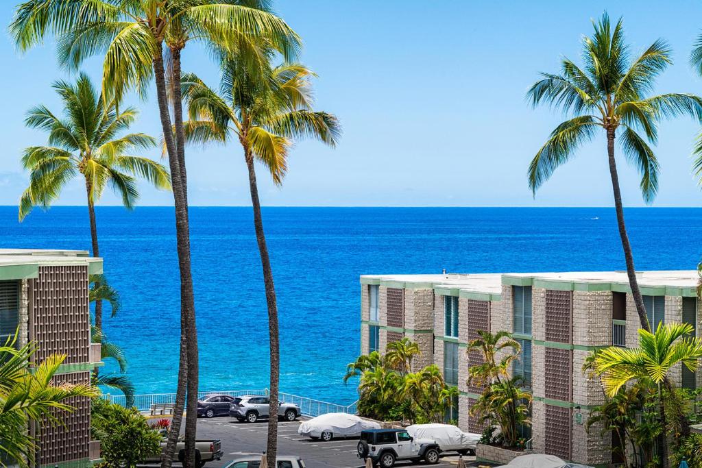 a view of the ocean from the balcony of a resort at Alii Villas 309 in Kailua-Kona
