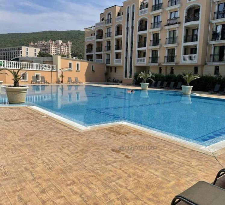 a large swimming pool in front of some buildings at Villa Astoria 5. Sveti Vlas k.k. Elenite in Sveti Vlas