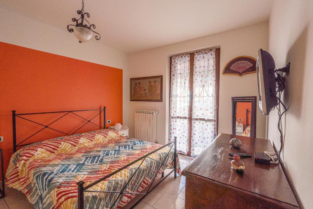 Postel nebo postele na pokoji v ubytování Alma Toscana