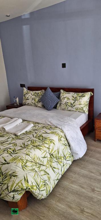 Postel nebo postele na pokoji v ubytování Lala Inn Kikopey