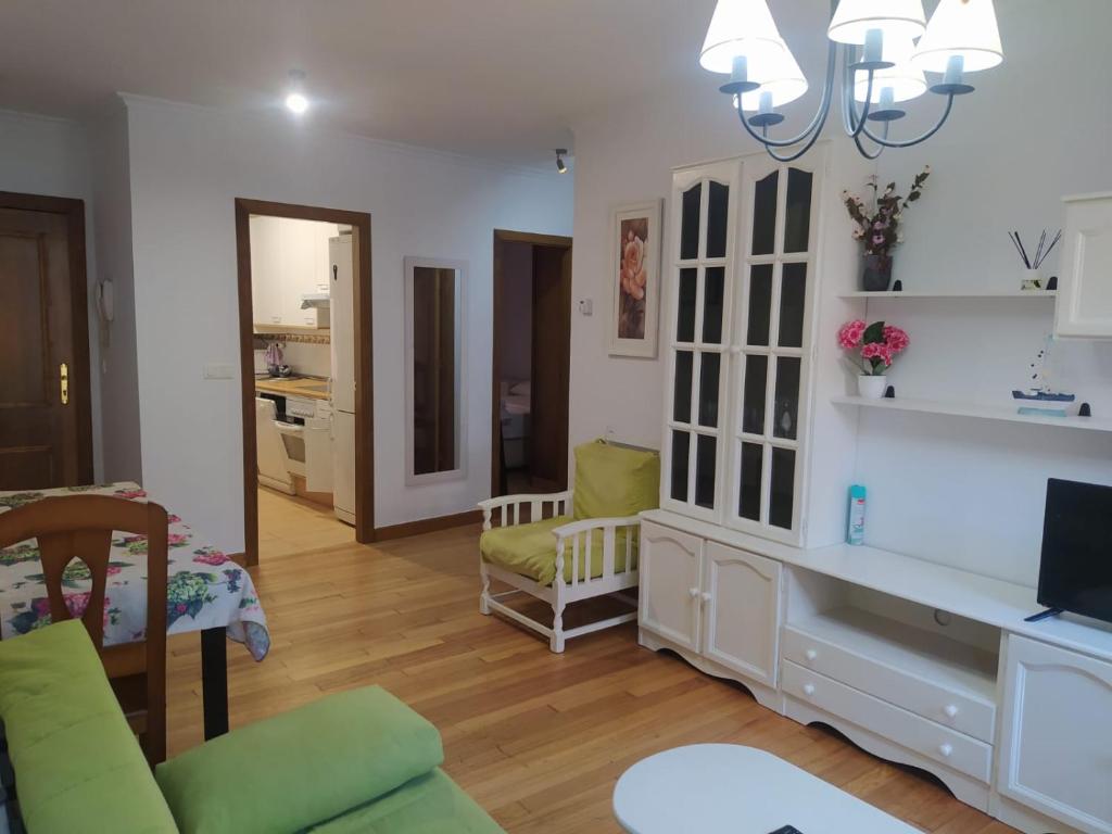 a living room with a couch and a table at La Gaviota in Comillas