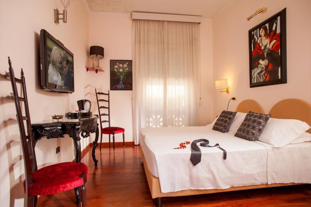 Postel nebo postele na pokoji v ubytování Hotel Sant'Angelo