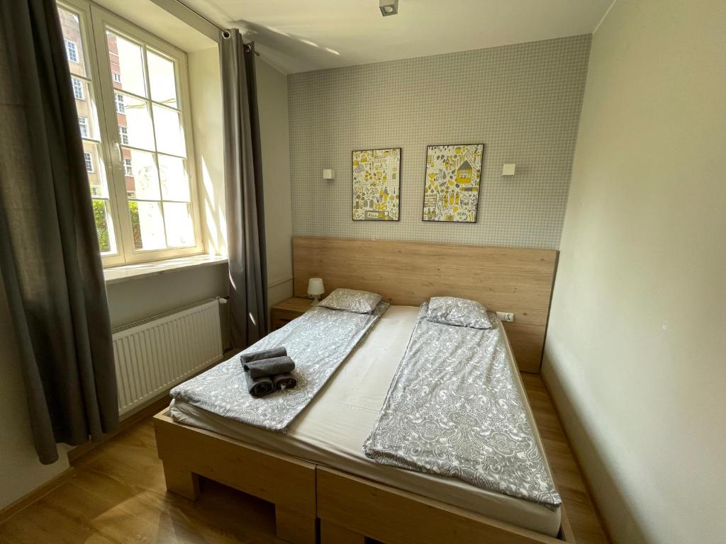 Posteľ alebo postele v izbe v ubytovaní RentApart Centrum