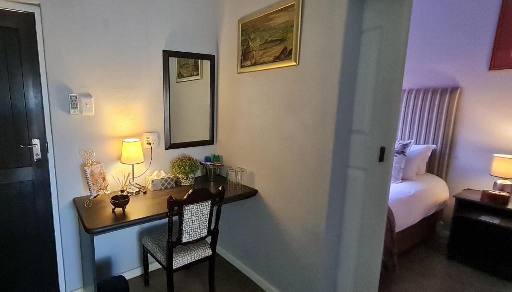 Postel nebo postele na pokoji v ubytování Kairos Guesthouse Orania