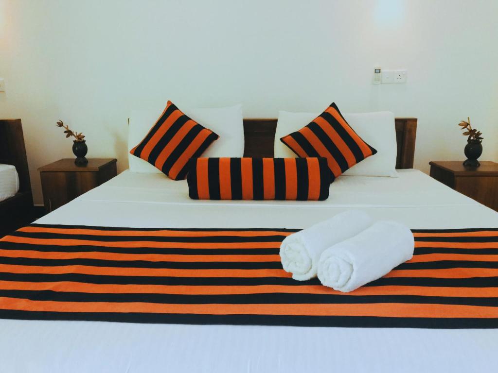 Postel nebo postele na pokoji v ubytování Sigiriya Ranasinghe Nature Villa