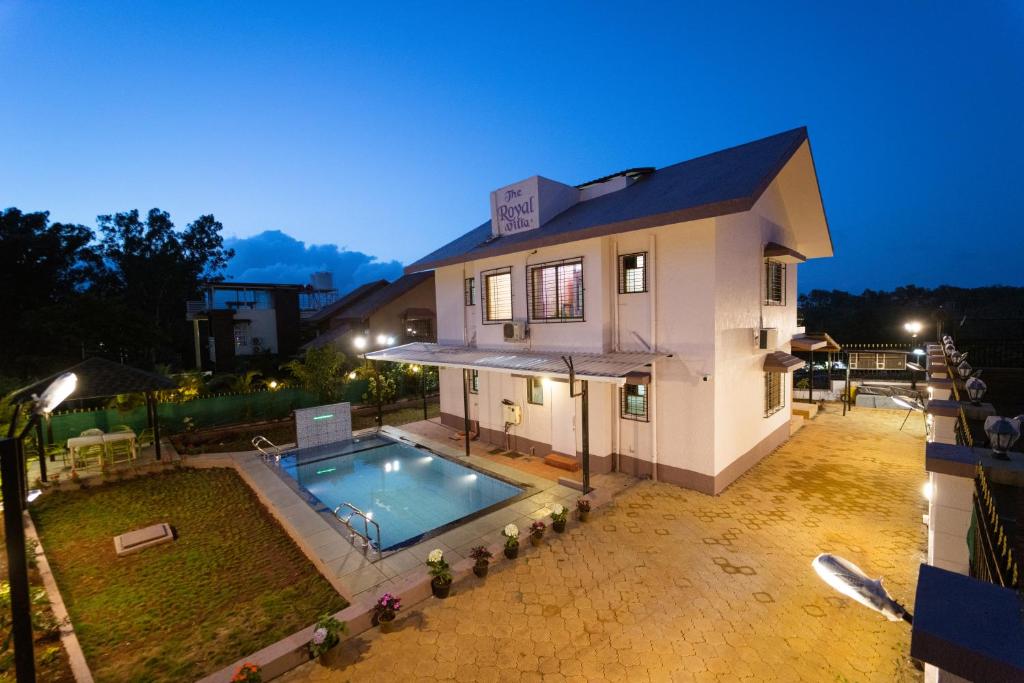 an aerial view of a house with a swimming pool at The Royal Villa in Panchgani