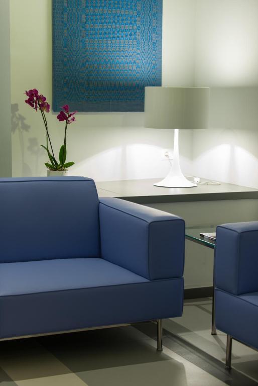 Posedenie v ubytovaní Executive Inn Boutique Hotel